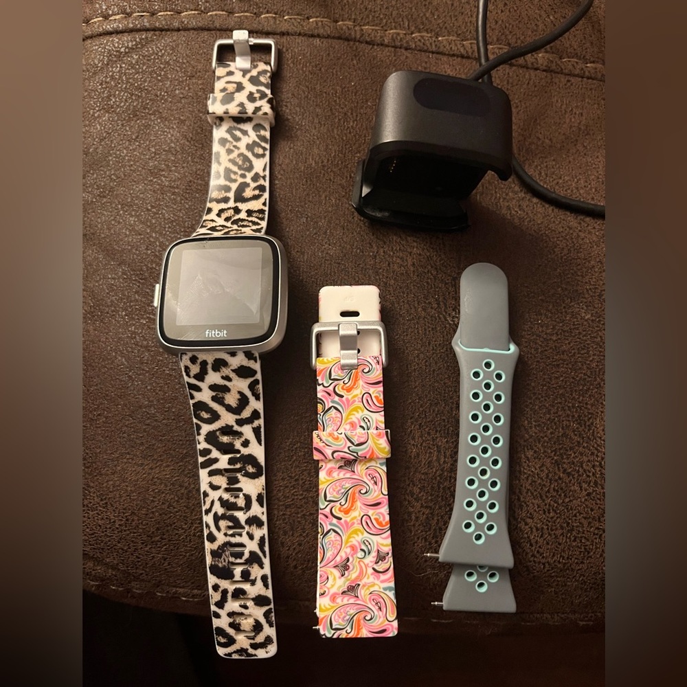 Fitbit Versa Lite with three bands and charger